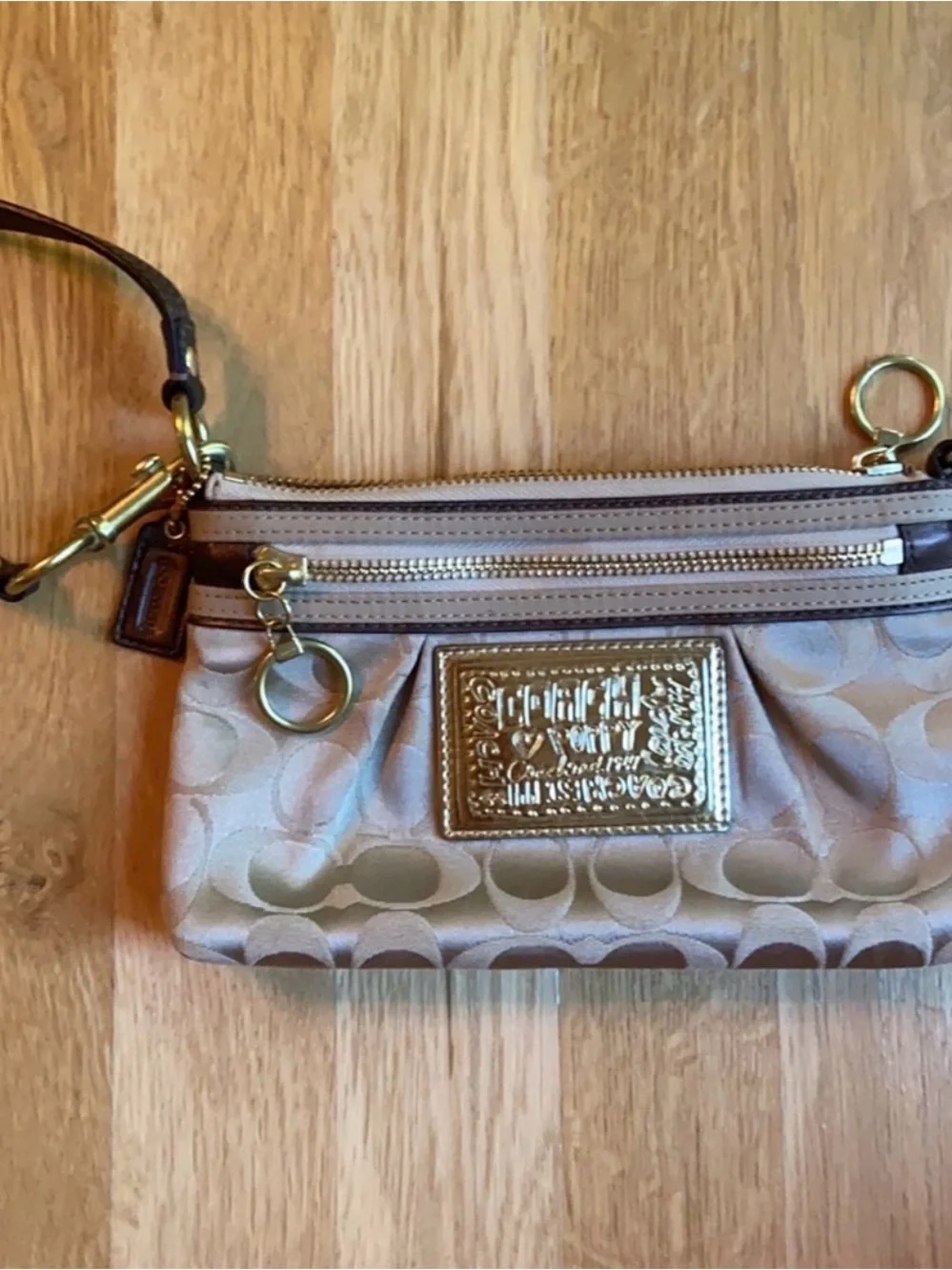 Coach Beige Signature Wristlet Pouch with Gold Logo Plaque